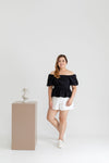 Textured Smocked-back Peplum Top (Black)